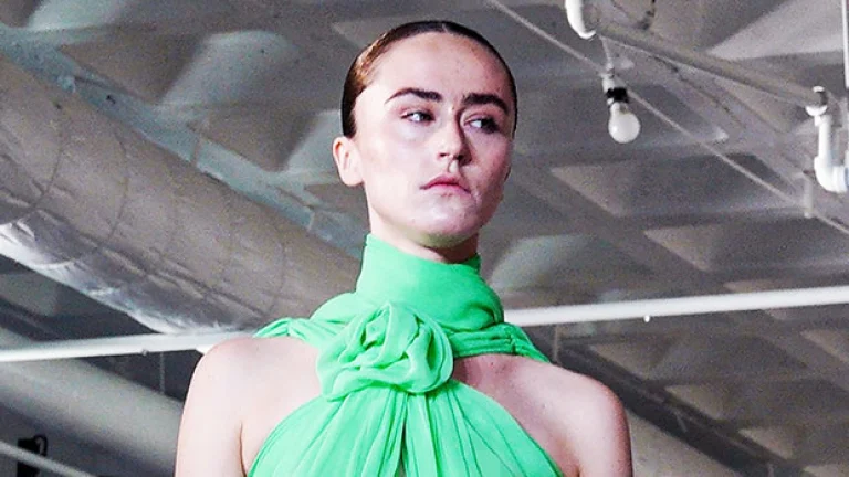 Kamala Harris’ stepdaughter Ella Emhoff wears nothing under a green Top on the NYFW runway
