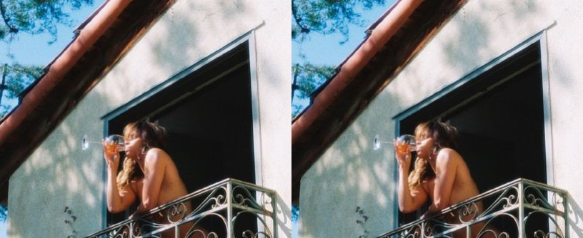 Halle Berry drinks wine as she wears nothing while standing on a Balcony: See Pics